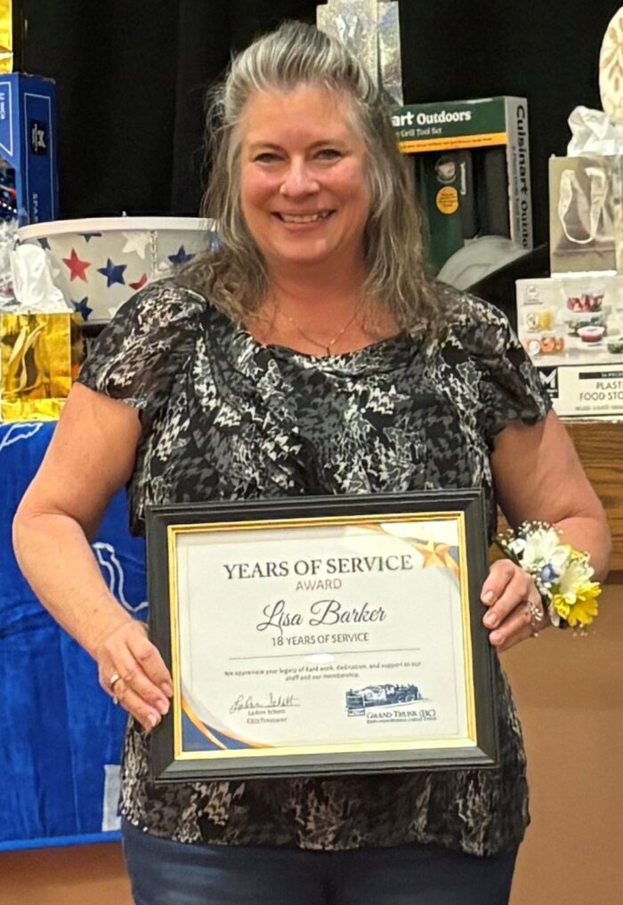 Lisa Barker receiving an award for 18 years of service at our 81st annual meeting. 