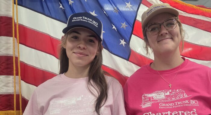 Harriet and Elleigh wearing GTCU hats.