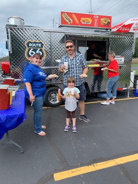 Members getting their treats from the hot dog stand