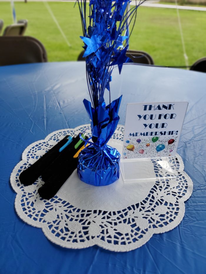 Picnic table with decorations saying Thank you for your membership